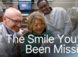 Doctor smiling with patient looking at new smile
