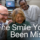 Doctor smiling with patient looking at new smile