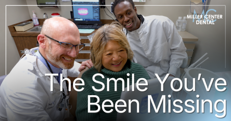 Doctor smiling with patient looking at new smile